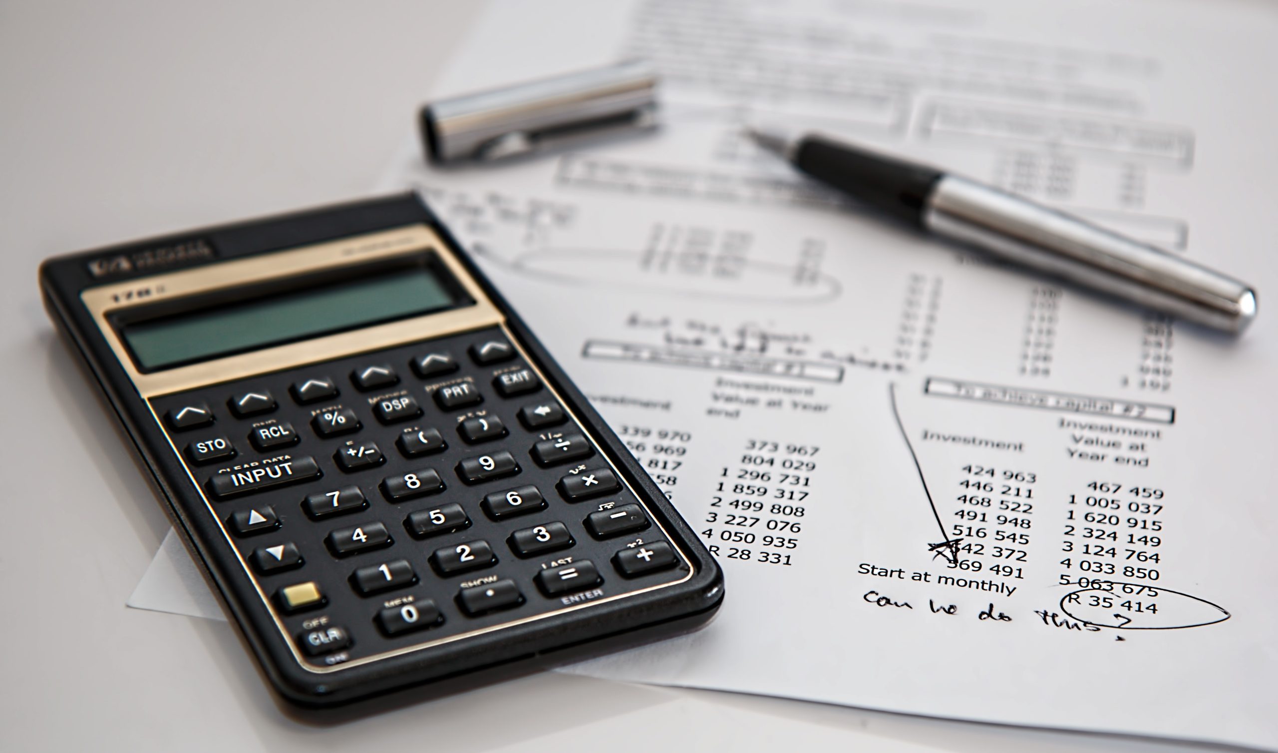 A calculator next to a financial plan